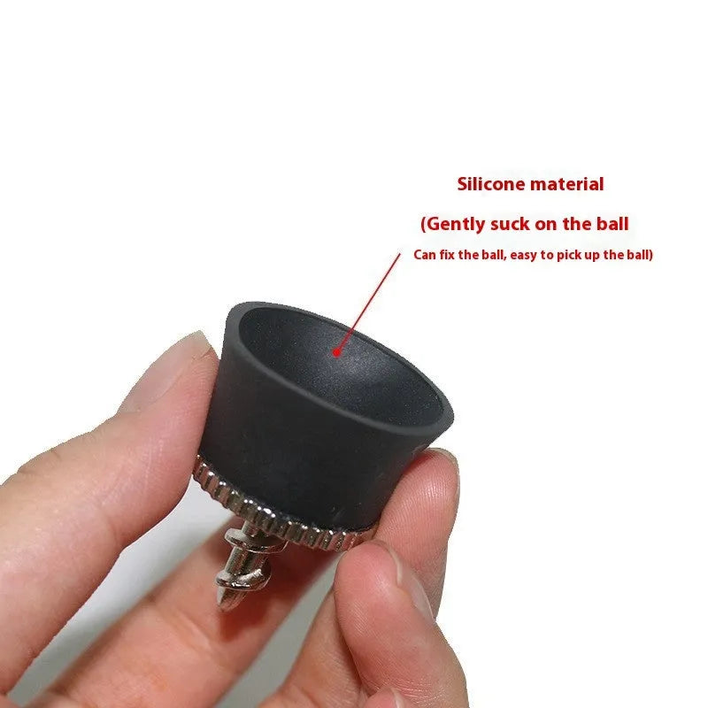 Black TPR golf ball suction cup picker with conventional size on a green surface