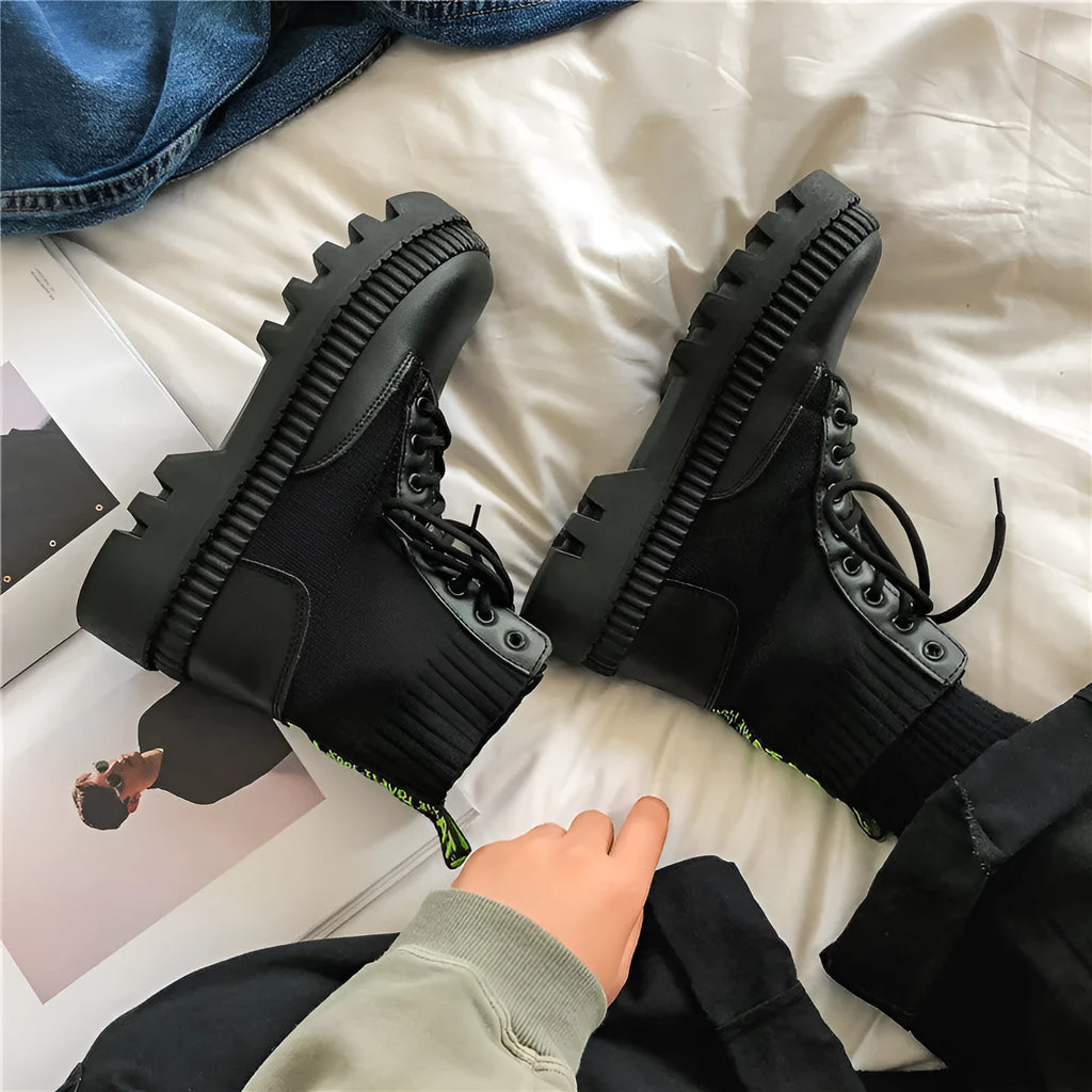 Men's black Dr Martens platform ankle boots with a side zip and frosted leather uppers.