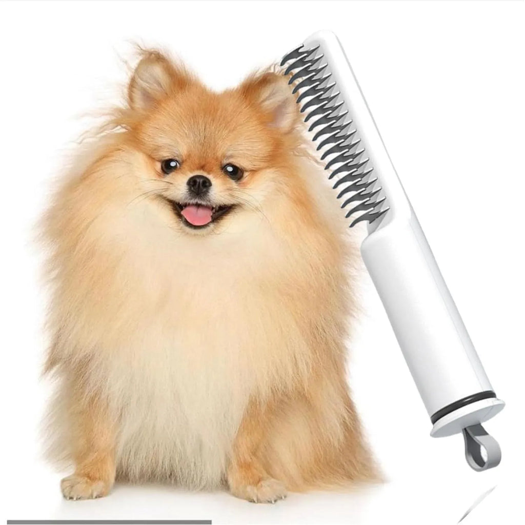 Pink and white stainless steel dog dematting comb with rake teeth on a wooden table.