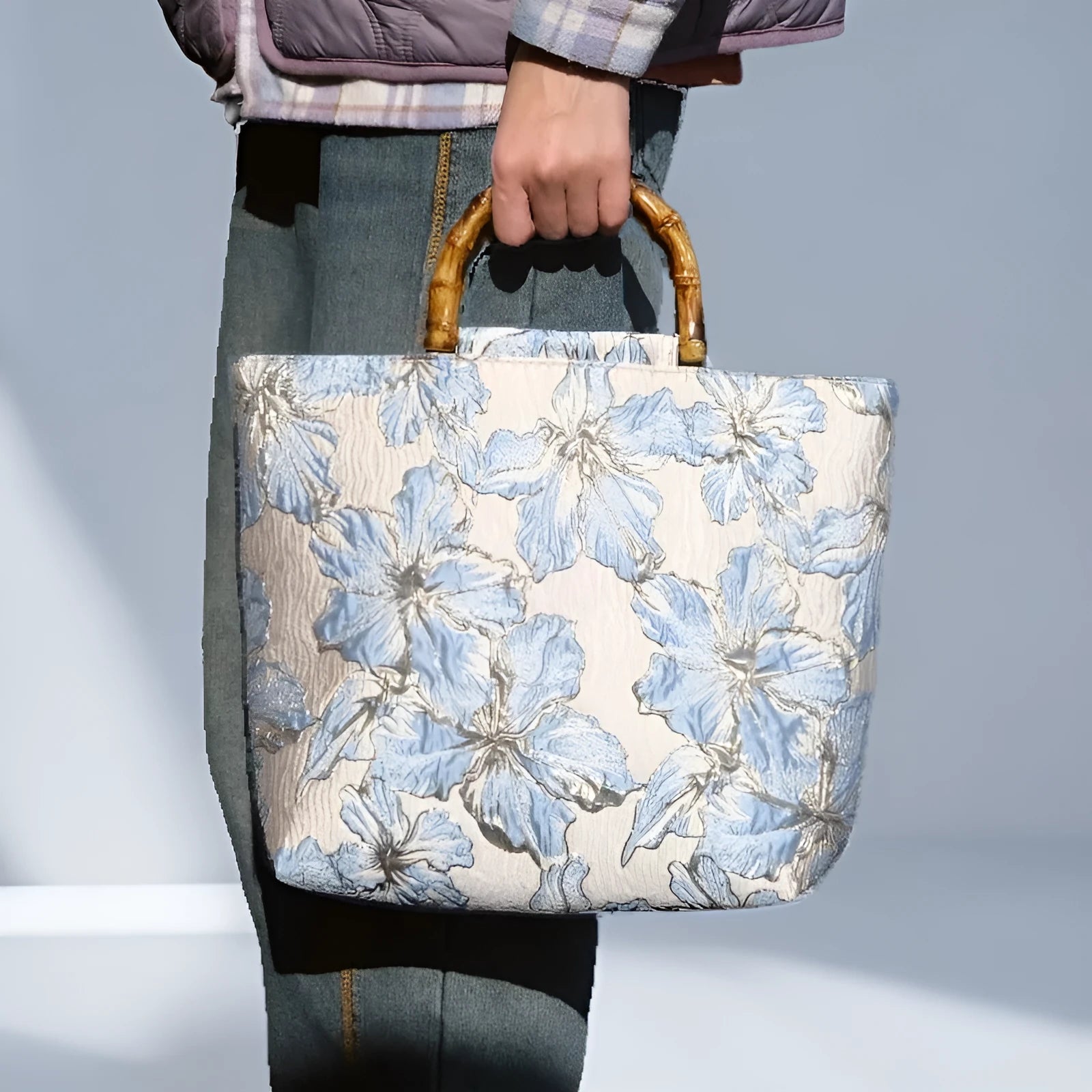 Light blue canvas shoulder bag with gold floral decoration and double shoulder straps