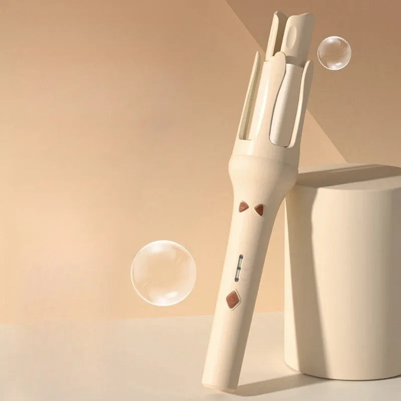 White and Chigo brand automatic hair curler with a 32mm barrel on a table.