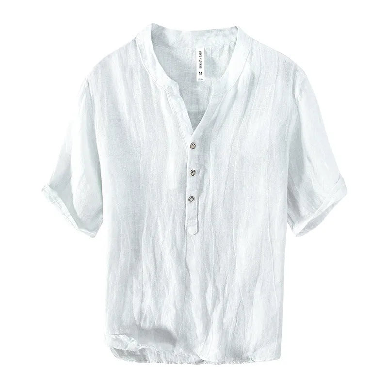 A grey linen short sleeve pullover top with a stripe pattern, laid flat.