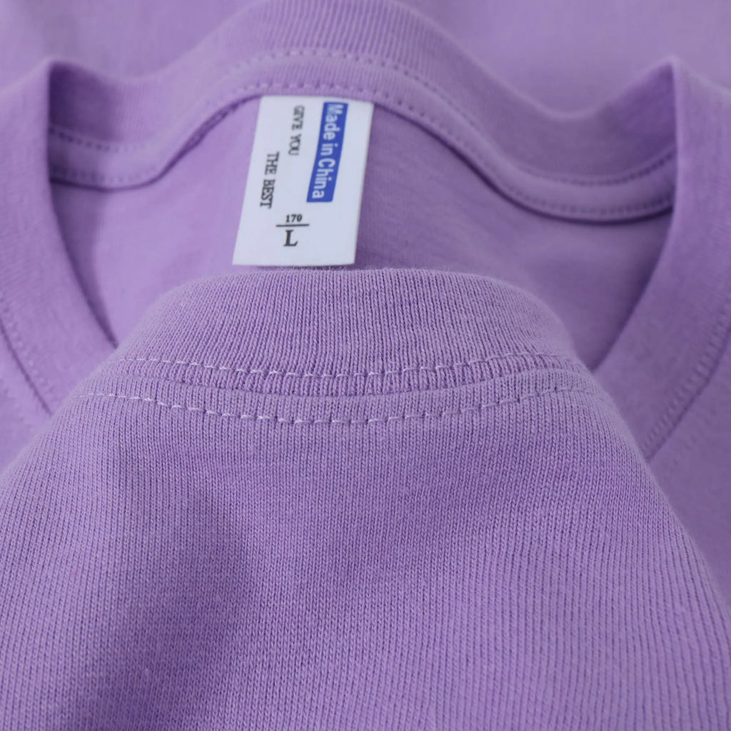 Loose-fit cotton T-shirt for men and women in multiple colour options including peacock blue and orange red.