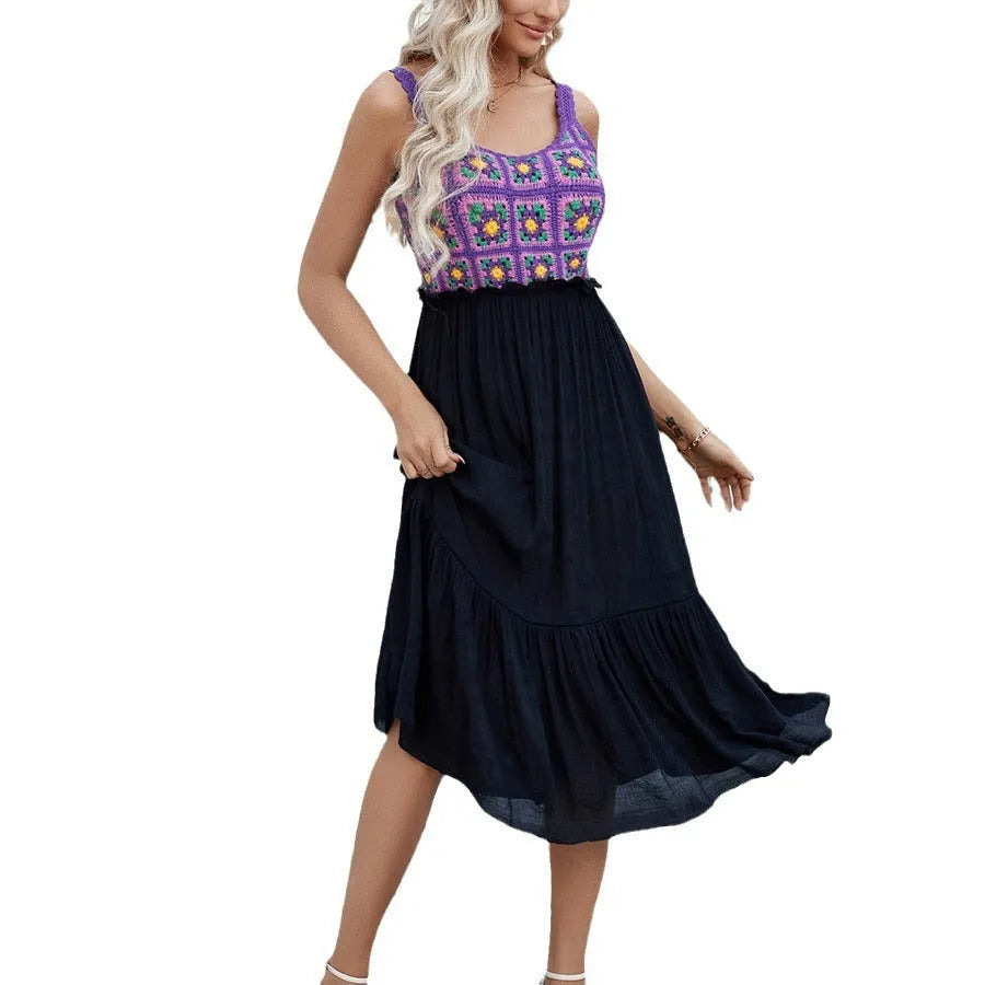 Purple sleeveless dress with raised hand-hooked floral embroidery on the fabric.