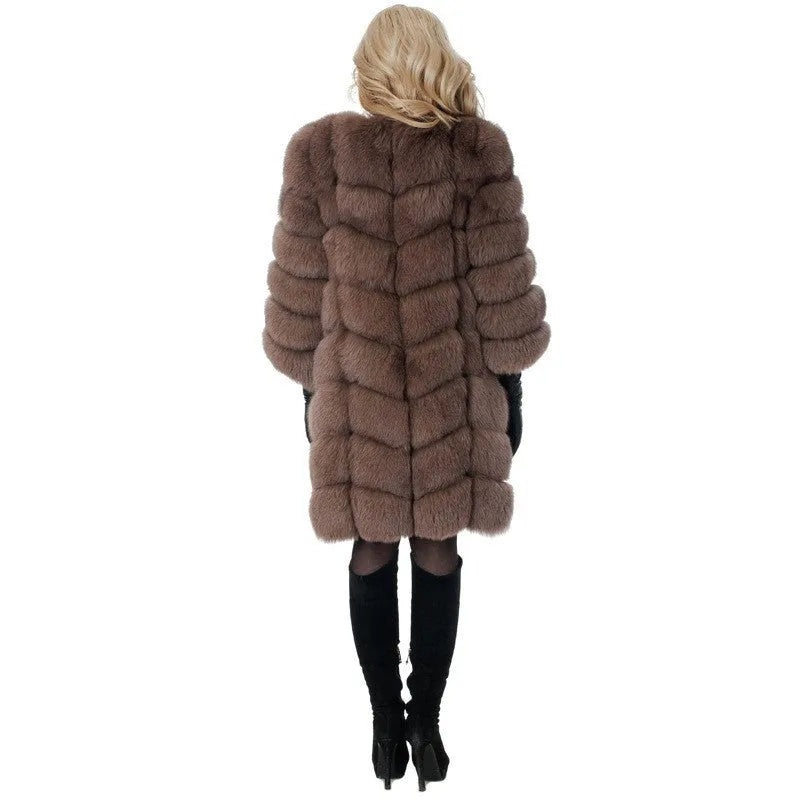 Women's long black faux fur coat with regular sleeves on a hanger.