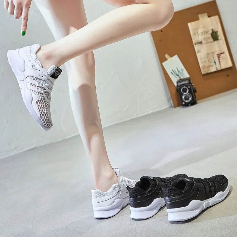 Breathable hollow out mesh casual sneakers in black and white colours with round toe design