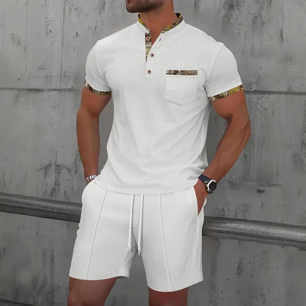 Man wearing a grey waffle-textured zip polo short sleeve top and matching shorts from a two-piece suit set.