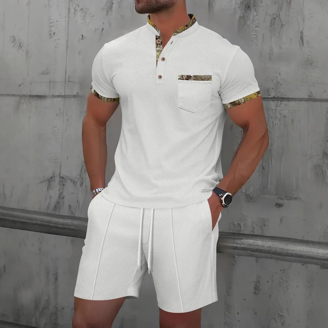 Man wearing a grey waffle-textured zip polo short sleeve top and matching shorts from a two-piece suit set.