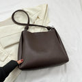Women's crossbody tote bag in retro bucket shape, PU material, available in yellow brown, brown, black, khaki, with sewing line detail