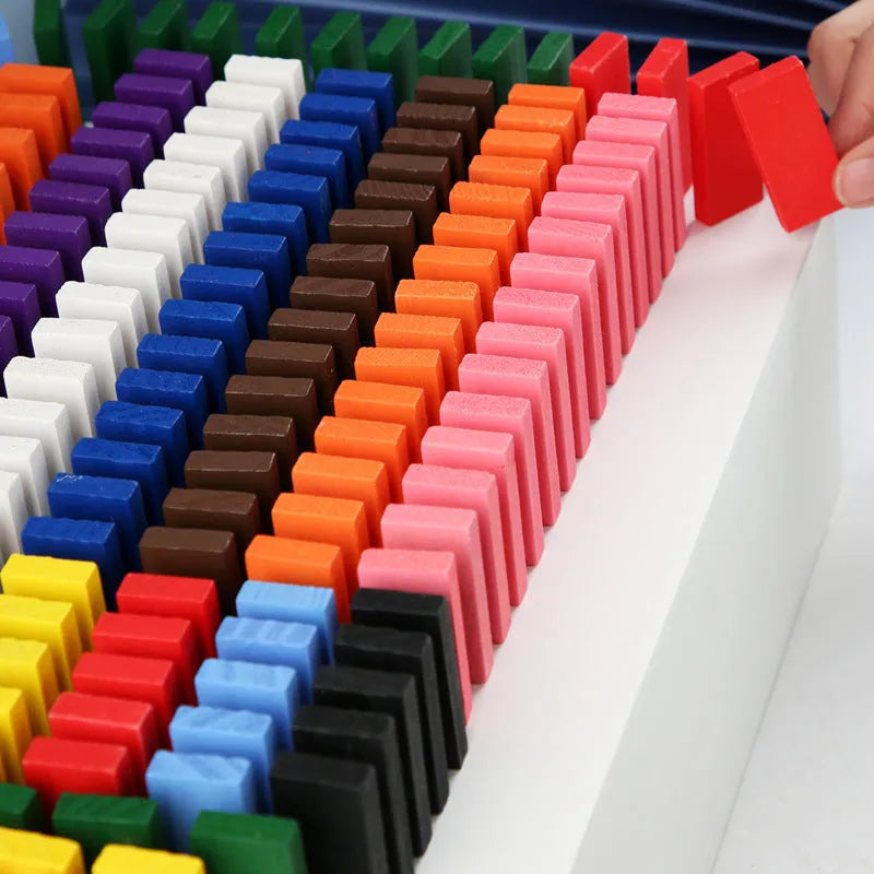 120-piece rainbow wooden domino blocks from pine wood with water-based paint on a flat surface
