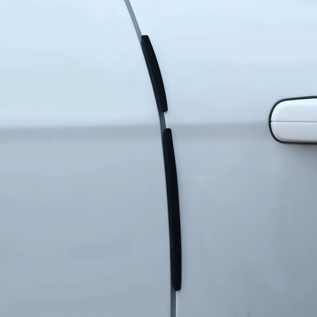 White plastic car door side bumper strip set for scratch protection.