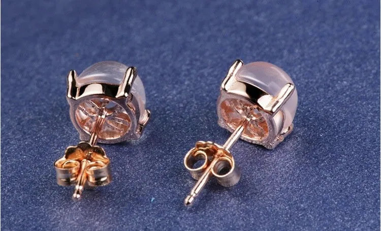 Rose gold drop shape stud earrings with synthetic Ross quartz crystal inlay