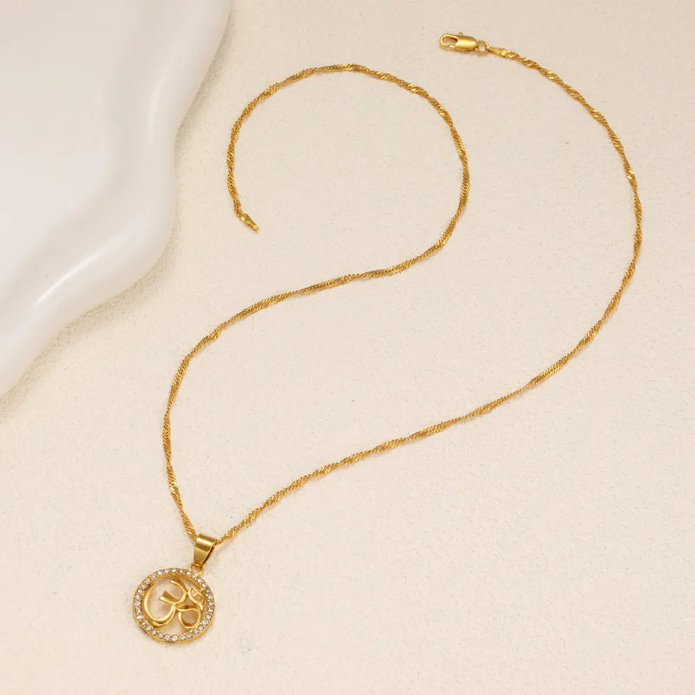 Gold plated copper necklace with circular OM pendant and inlaid stones