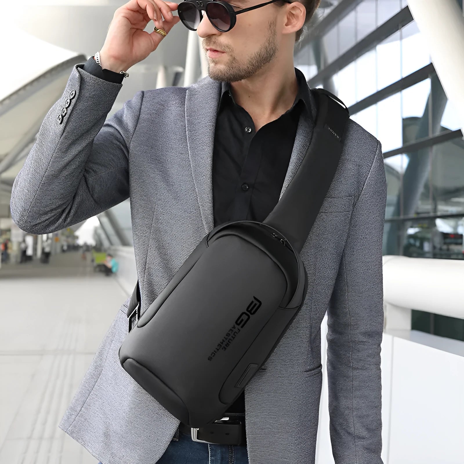 Men's black casual shoulder bag with USB port for business travel, made from Oxford cloth.