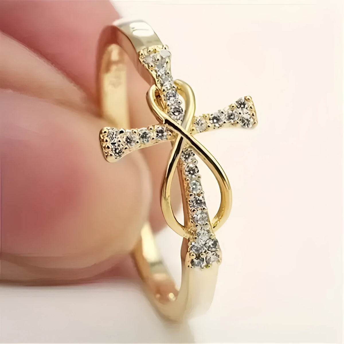 Geometric copper ring for women in gold colour finish, shown on a finger against a neutral background.