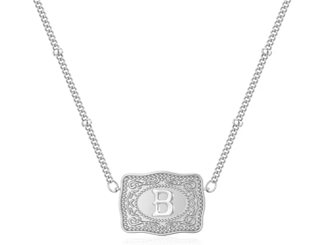 Copper electroplated gold tone necklace with a capital letter 'A' charm pendant on a chain.