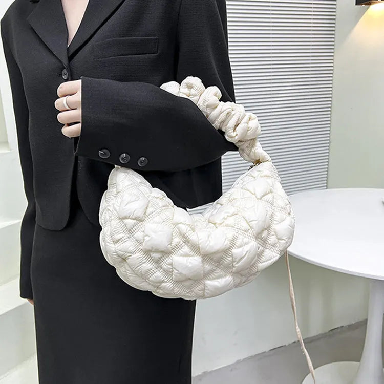 Women's nylon messenger bag in solid colour with adjustable shoulder strap, shown in beige