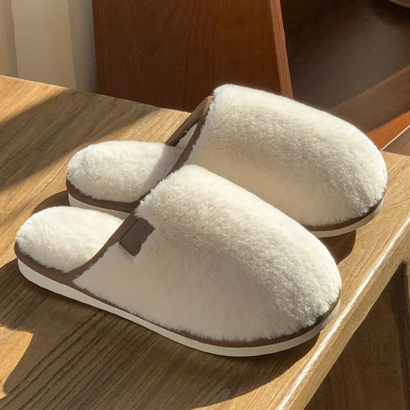 A pair of solid-colour winter plush slippers with a non-slip PVC sole, shown in a selection of available colours.