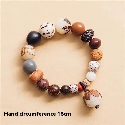 Handmade Bodhi seed bracelet with 18 natural beads on wrist, showing geometric national style design
