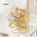 Rotating cosmetics storage box in clear or amber gold colour on a vanity