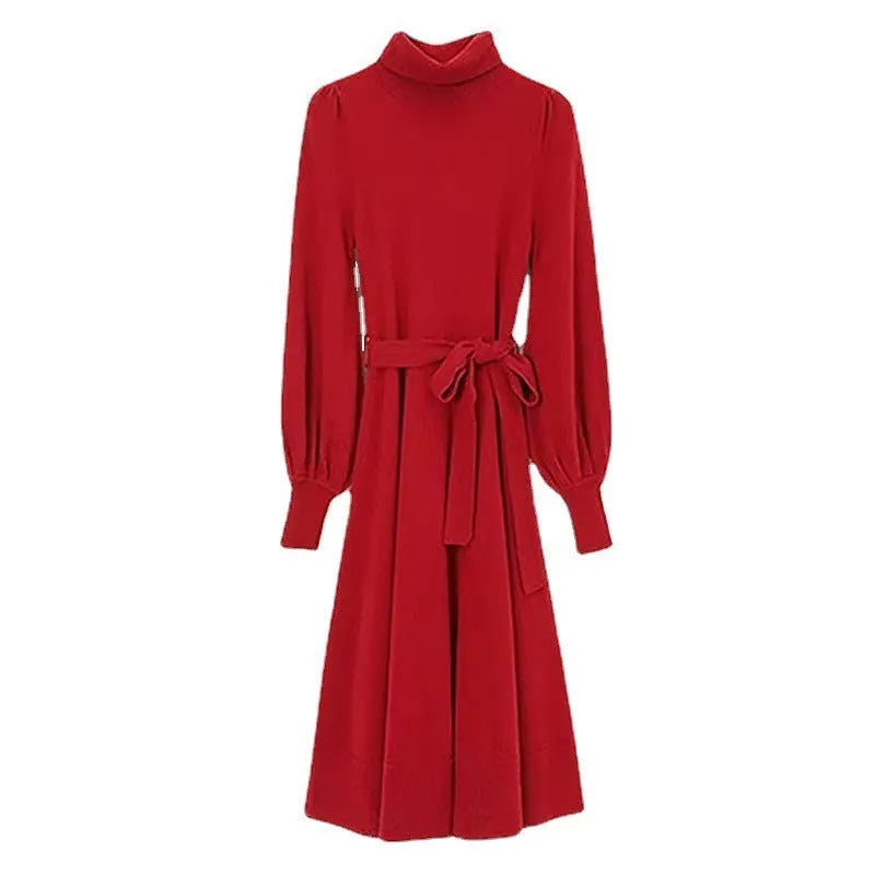 Rose red loose turtleneck knit dress with long sleeves and a flared skirt hem on a hanger.