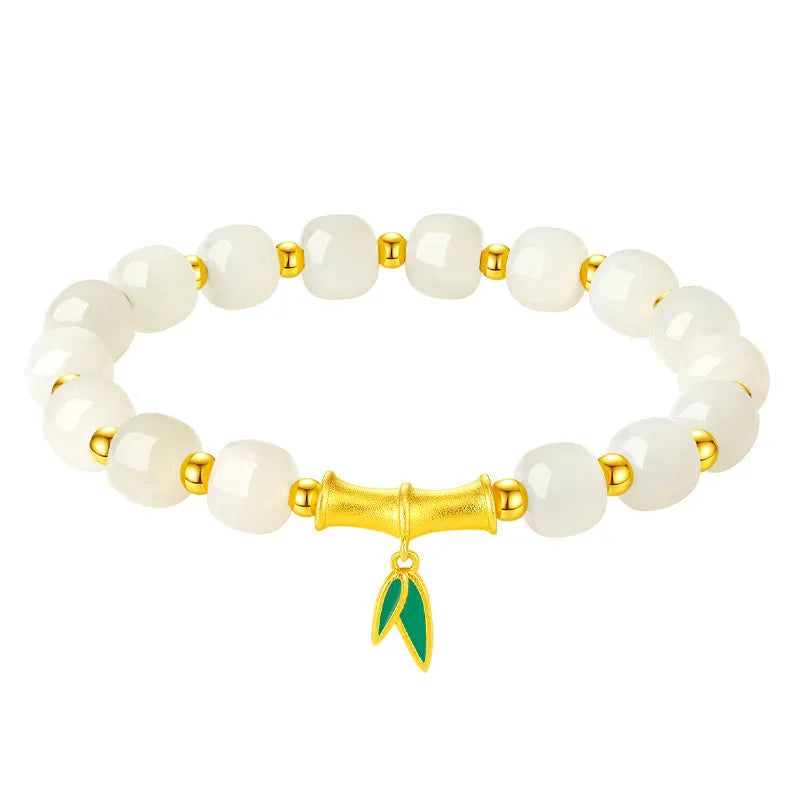 S925 sterling silver bracelet with round Hetian jade beads and bamboo leaf charms.