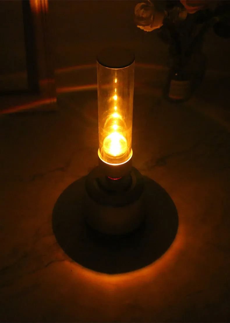 White silver Bluetooth speaker with integrated candlelight atmosphere night light.