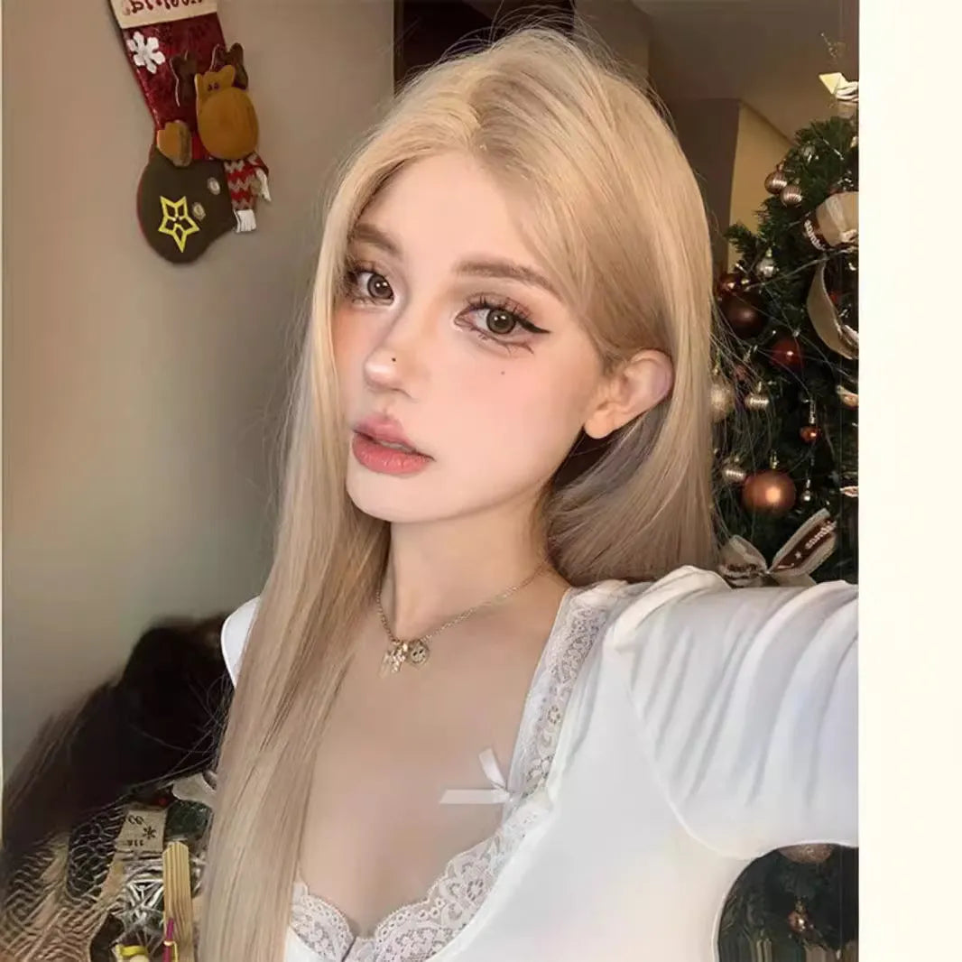 Long straight milk tea blonde synthetic wig on a stand with hair net