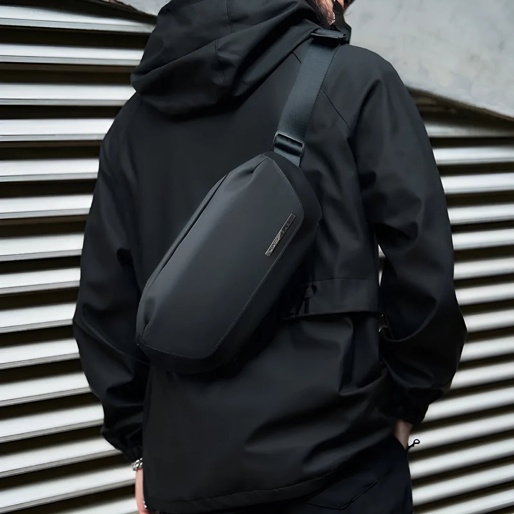 Black Oxford cloth men's messenger bag with single shoulder strap and sewing thread details
