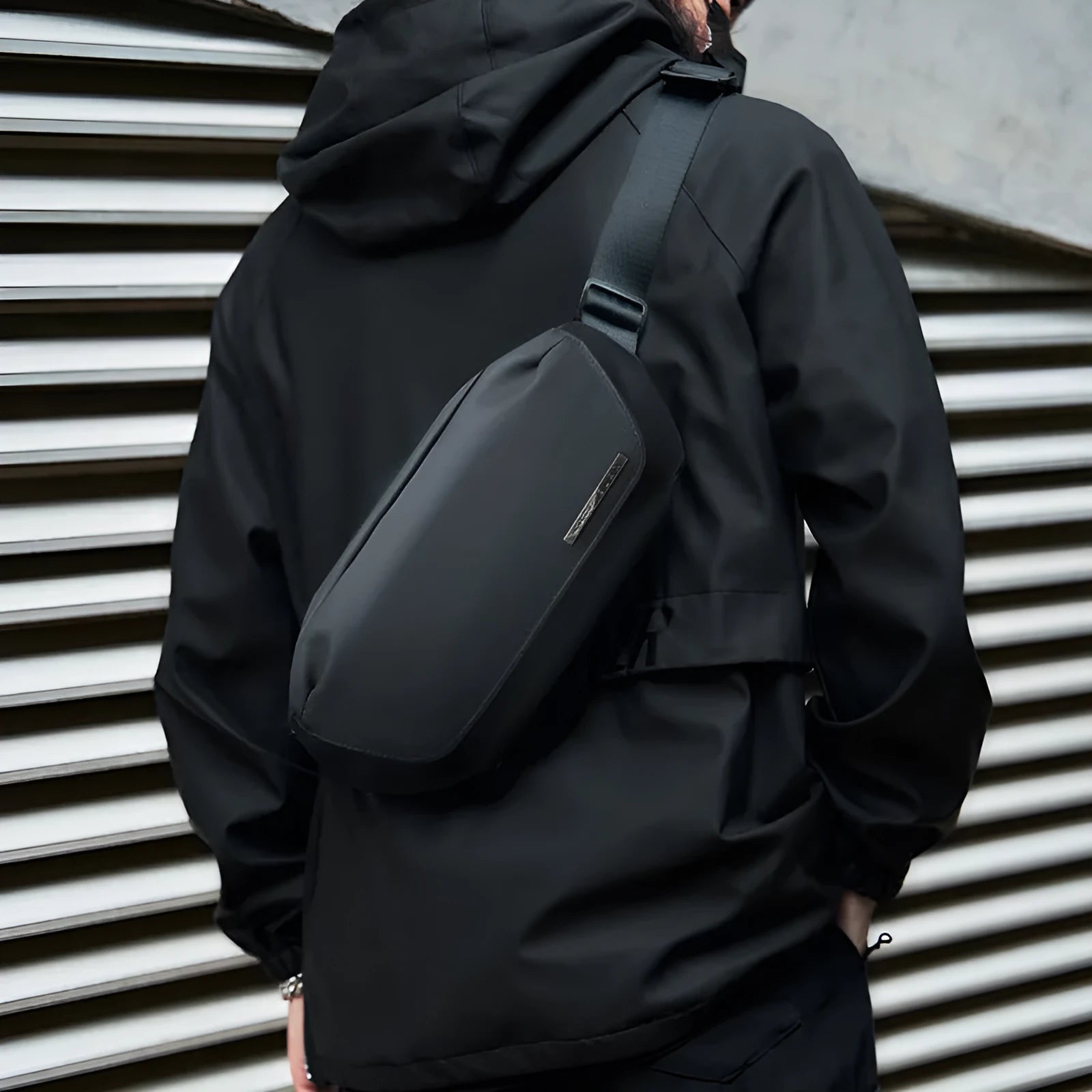 Black Oxford cloth men's messenger bag with single shoulder strap and sewing thread details