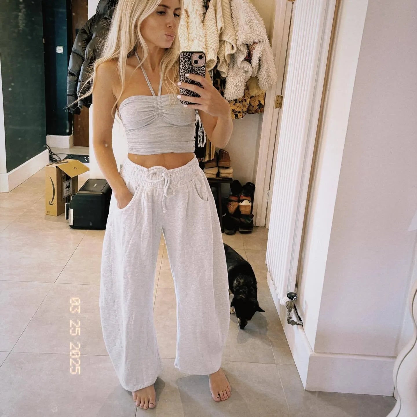 Women's loose cropped sweatpants in cotton fabric with elastic drawstring waistband in street fashion styling