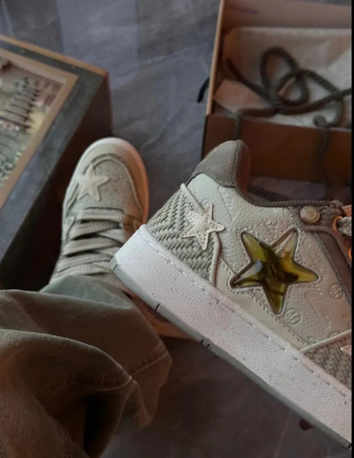 Green low-top casual shoes with star pattern stitching and thick rubber sole.