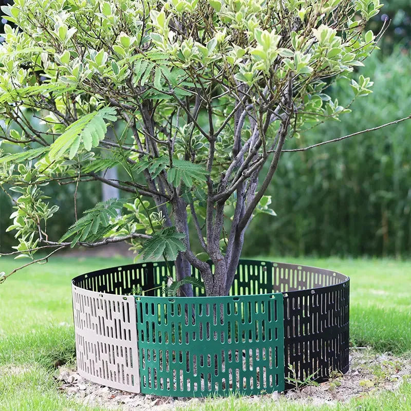Plastic simulated bark protective cover for trees in a garden setting, available in gray, green, and black