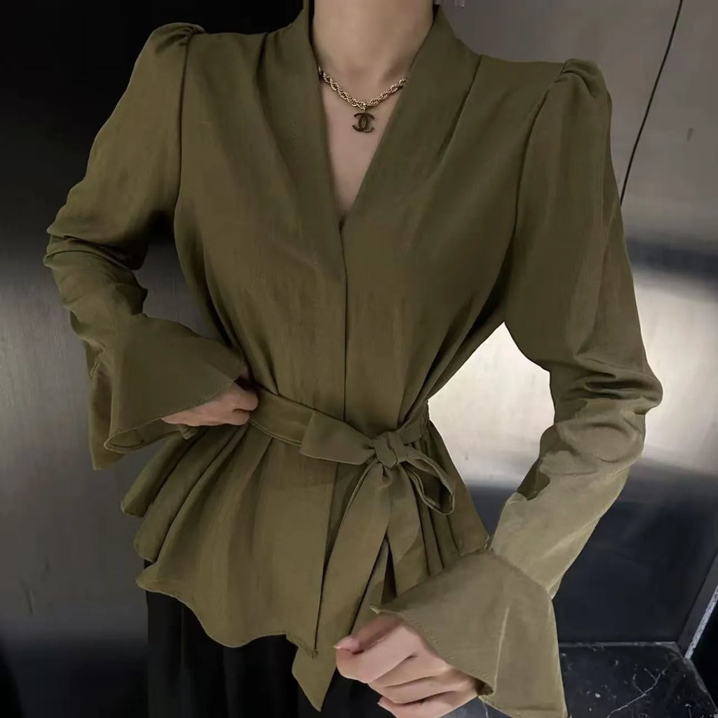 Women's black French-style shirt with long bell sleeves, an irregular collar, and a tied front detail.