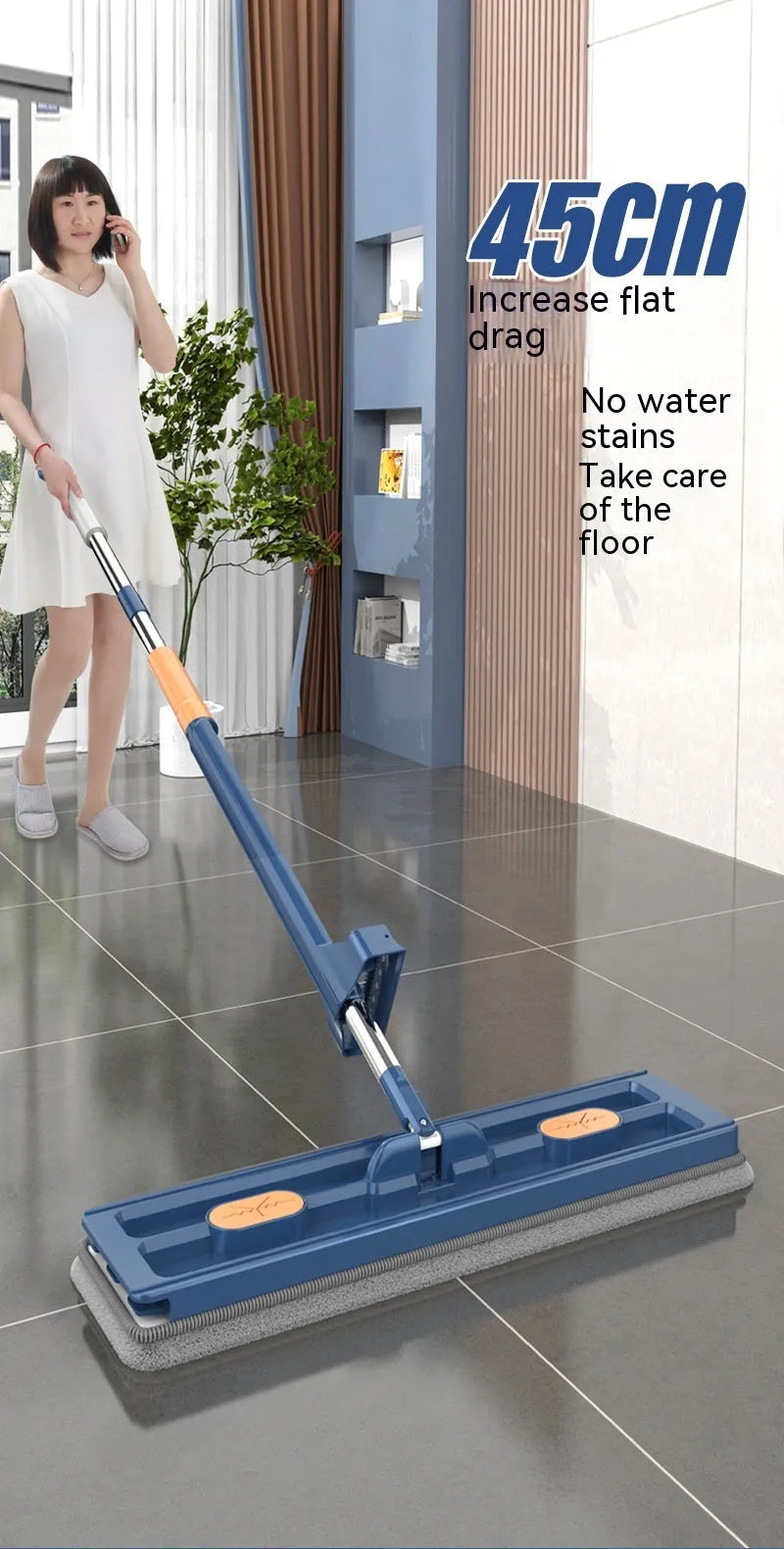 Large flat mop with long stainless steel handle and blue fine fibre mop cloth on a tiled floor