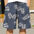 Man wearing loose striped ice silk beach trousers on sand