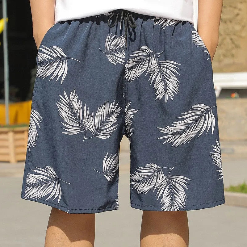 Man wearing loose striped ice silk beach trousers on sand