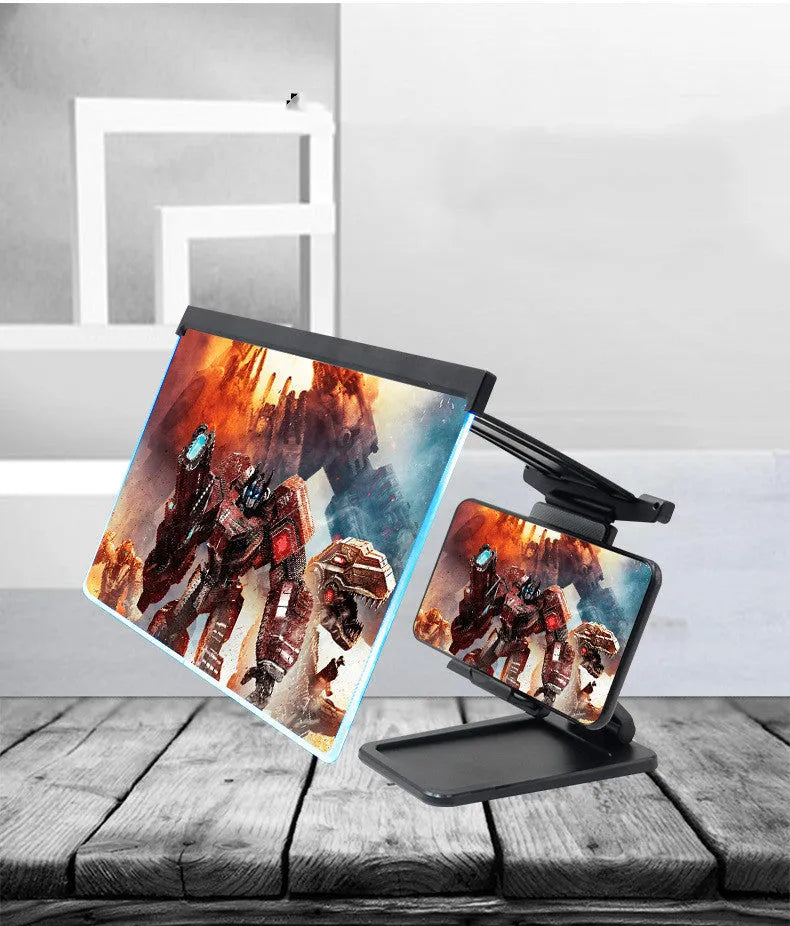 Black folding mobile phone screen amplifier with detached phone holder on a desk