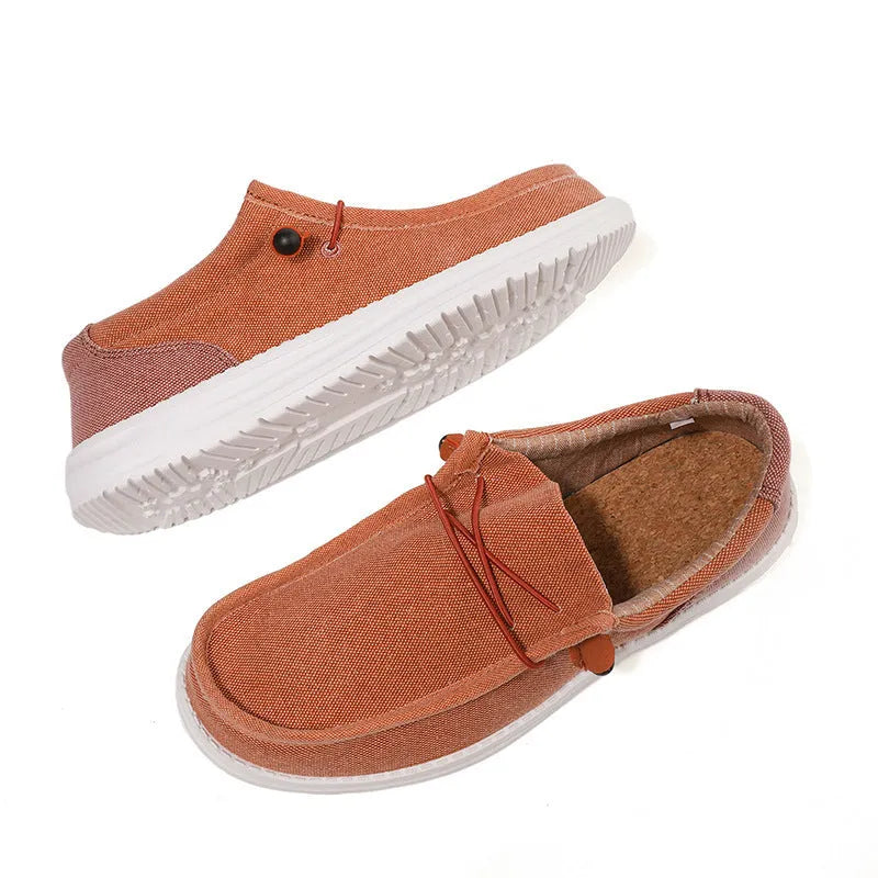 Men's green and orange canvas casual shoes with mosaic design and rubber sole.