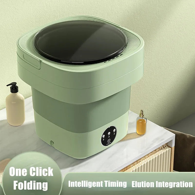 Green foldable portable mini washing machine for socks and underwear with drain pipe and basket.