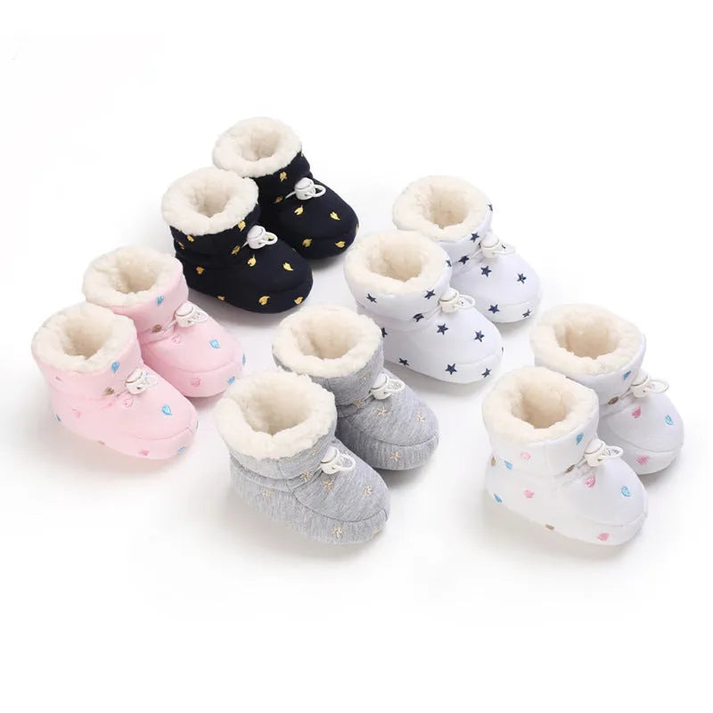 Baby autumn winter cotton shoes with tall crown, elastic band, non-slip sole, in black and white, dark blue, gray, or pink.