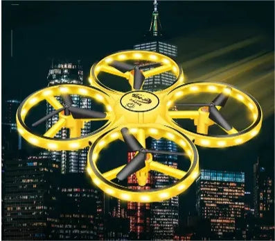 Gesture sensing flying saucer toy with ABS plastic body and four-axis design on white background