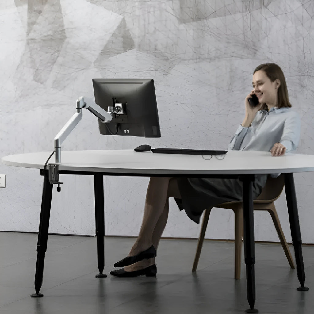 Aluminium alloy computer stand with adjustable arm bracket in silver colour supporting a laptop