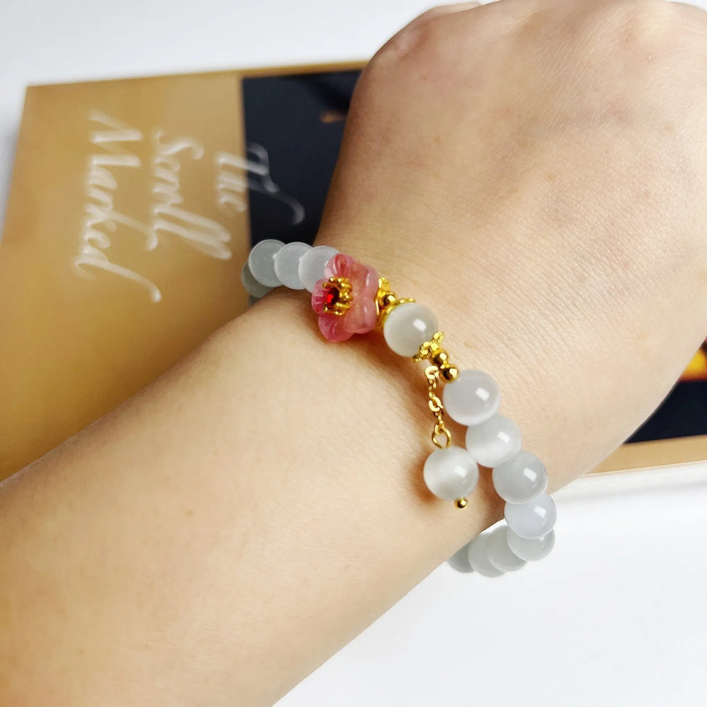 White opal flower beaded bracelet with colourful glaze accents on glass beads.