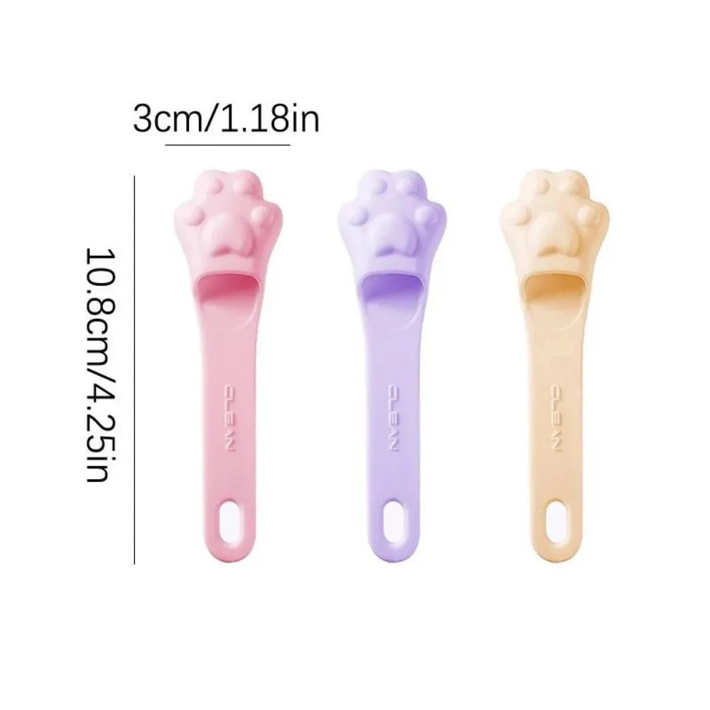 Silicone finger toothbrush for pets in pink, purple and yellow colours