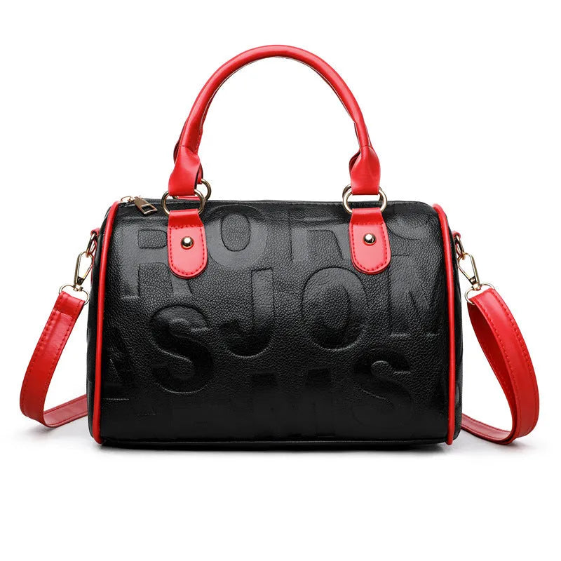 Brown cylindrical crossbody bag with three adjustable shoulder straps showing suitcase shape