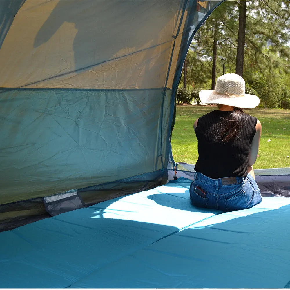 Khaki fully automatic hexagonal camping tent set up outdoors with two doors and dome shape, for 5-8 people