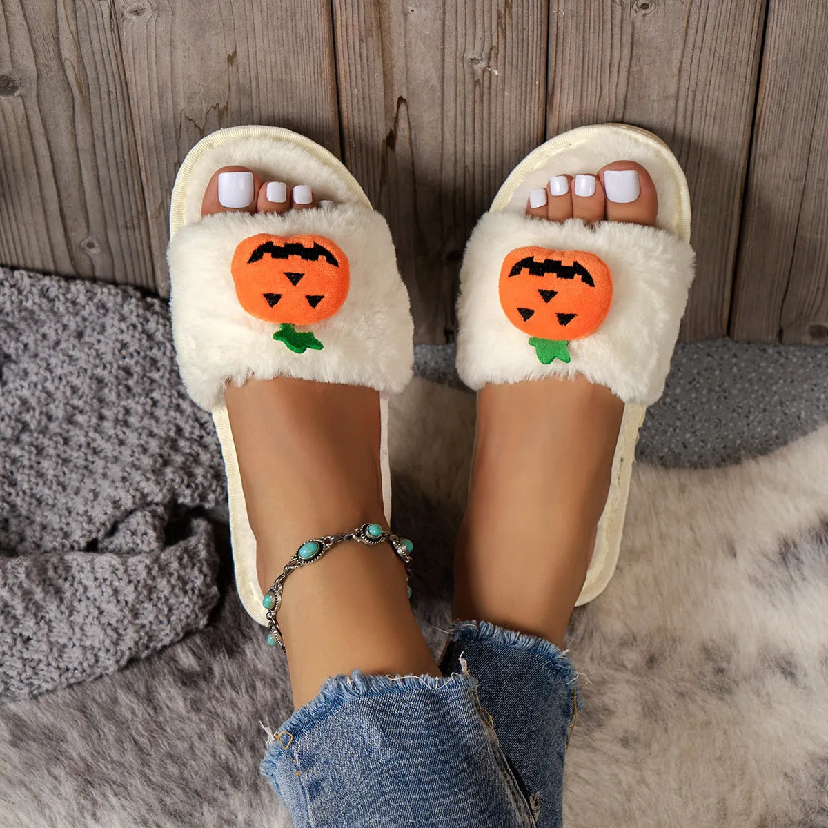 Women's white and yellow pumpkin cartoon plush open toe slippers on anti-slip PVC sole.