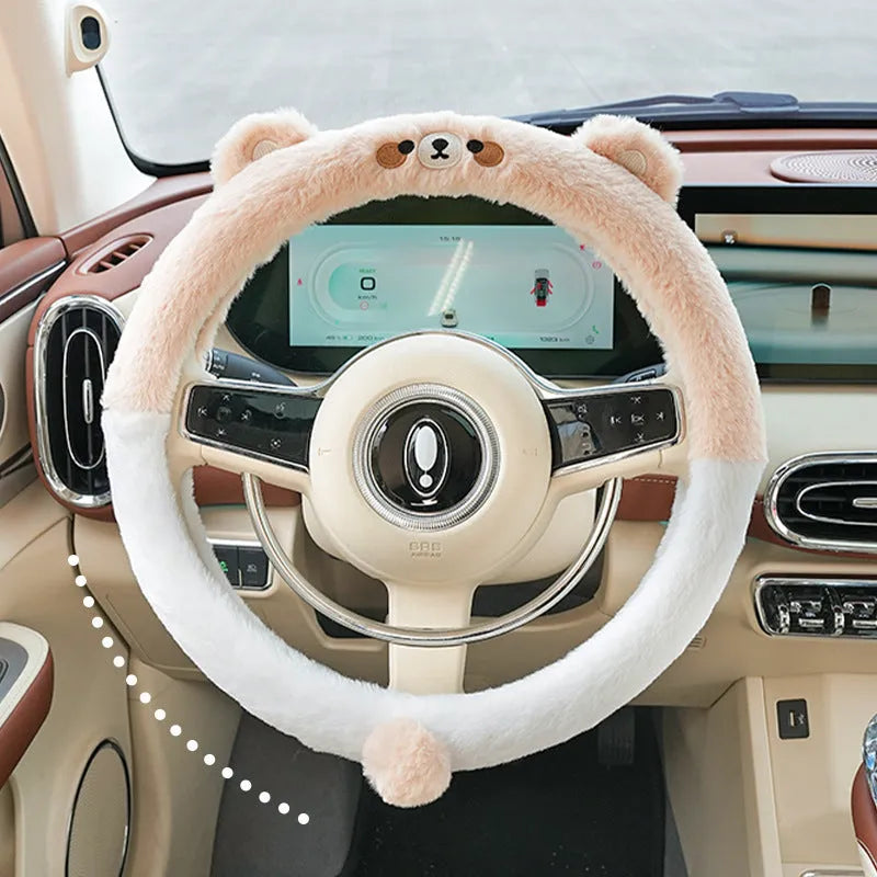 Plush rabbit fur winter steering wheel cover with cute embroidered panda design, shown fitted on a car steering wheel.