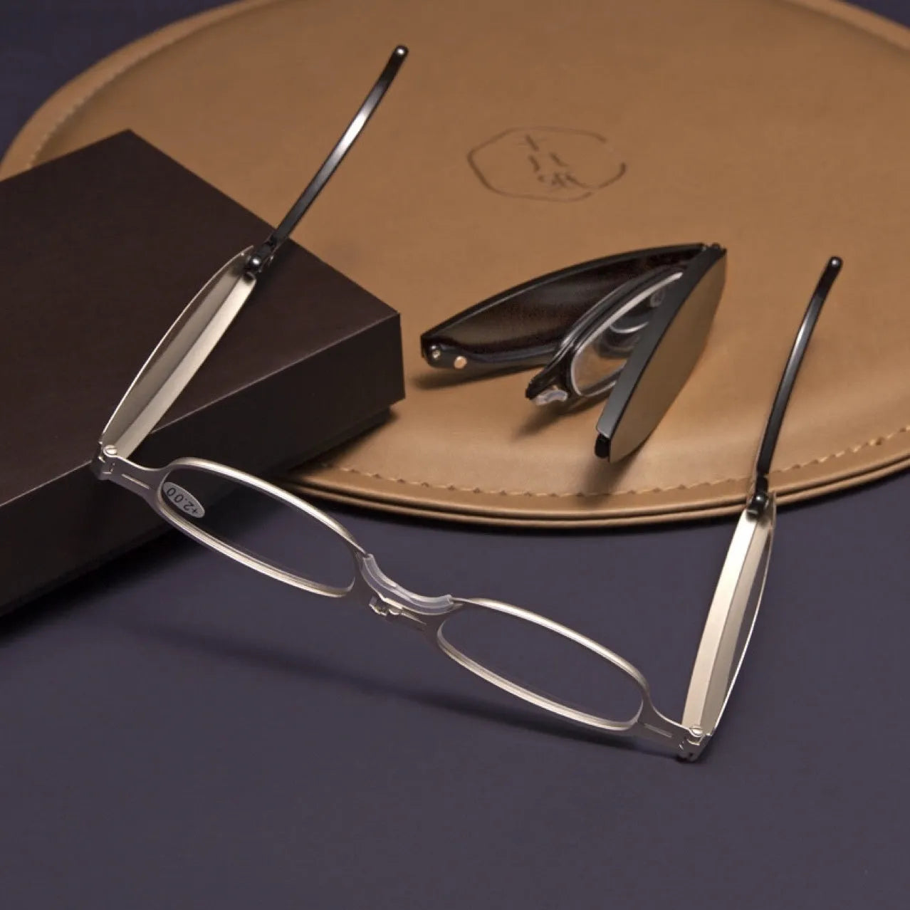 Folding presbyopic reading glasses in retro style with ring detailing, shown in black frame